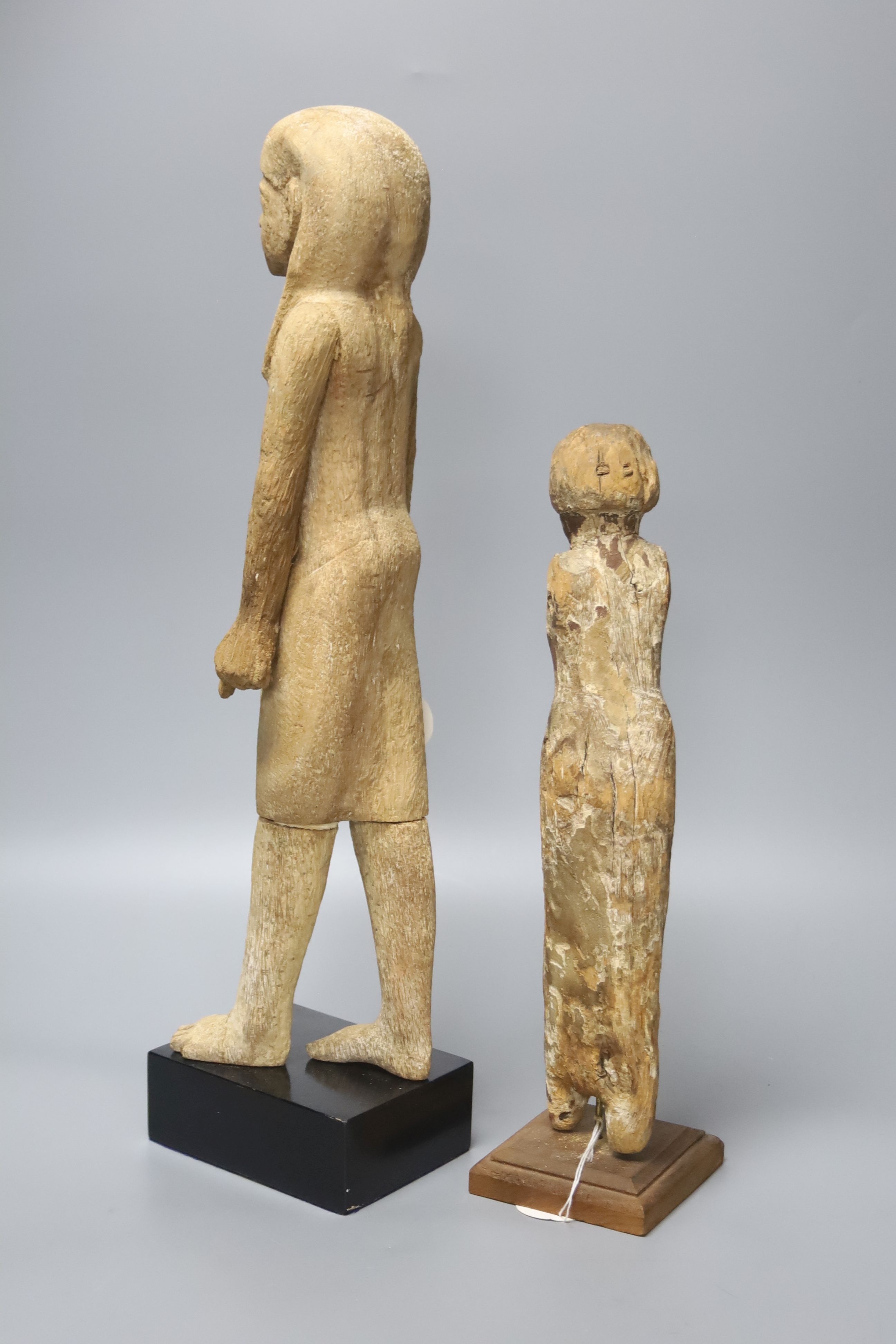 Two Egyptian wood figures, one possibly Coptic period